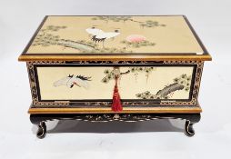 Modern Chinese gold-coloured lacquered low side cabinet decorated with cranes within trees, drop
