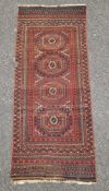 Persian rug with burgundy ground with blue geometric squares in red, blue and cream, multiple