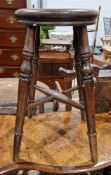 Late 19th/early 20th century stool with elm seat and raised on four turned tapering legs united by a