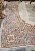 Large floral carpet in red, pink, blue and mustard, boteh borders in turquoise, cream and pink,