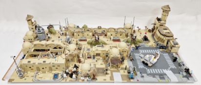 Large Lego Star Wars Tatooine diorama fetauring several Lego Sets to include No.75290 Mos Eisley