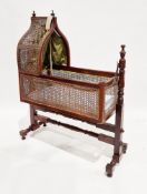 19th century mahogany and bergere swing rocking cradle/crib of revived Gothic style, the  ogee-