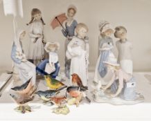 Lladro figure of girl with cello, another Edwardian-style lady with parasol, another girl seated