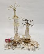 Quantity costume jewellery to include simulated pearl necklaces, jewellery stands etc Property of