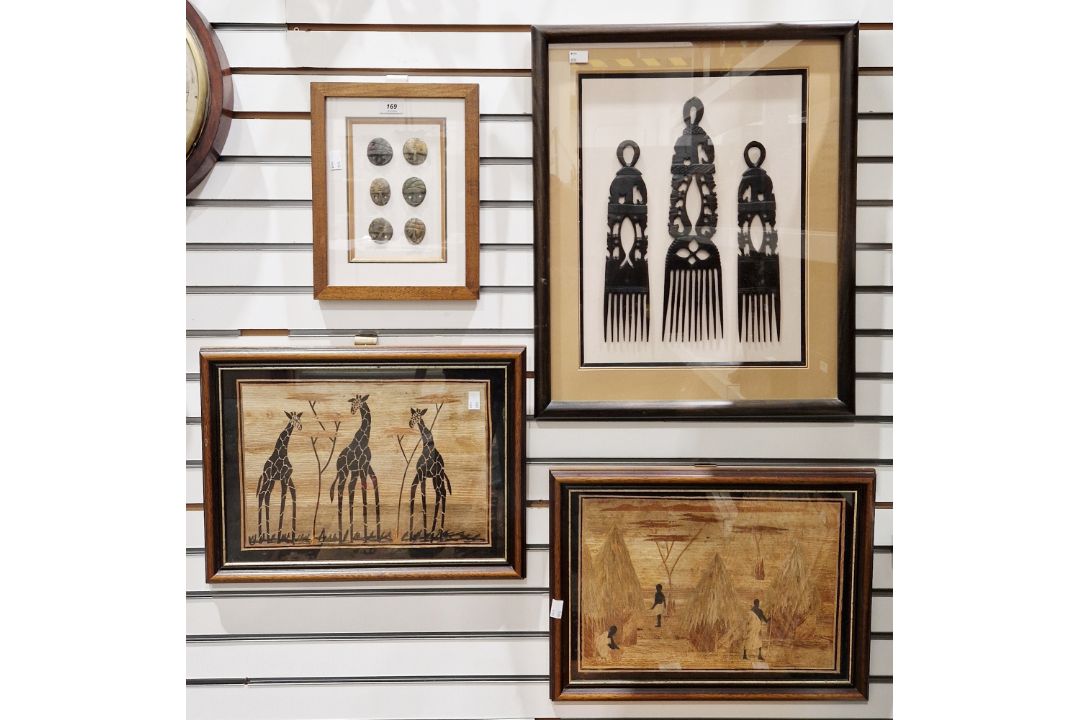 Set of three African Ashanti wooden carved combs, largest 35cm high, mounted, framed and glazed as a