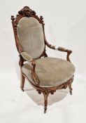 Victorian walnut framed salon chair, the domed top rail with shell and floral carved cresting, green