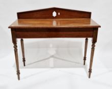 Late 19th century mahogany side table, the rectangular top with back rail and inset quadrant moulded
