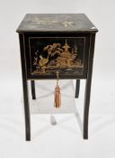 Early 20th century sewing table with a black lacquered and chinoiserie finish, the hinged lid