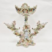 Continental porcelain comport centrepiece, the central oval pierced basket scroll embossed and