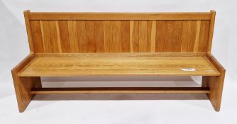 Modern golden oak long hall bench with panel back and solid square legs, having a loose cushion