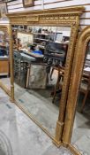 Large 19th century gilt overmantel mirror, the rectangular moulded frame decorated with foliate