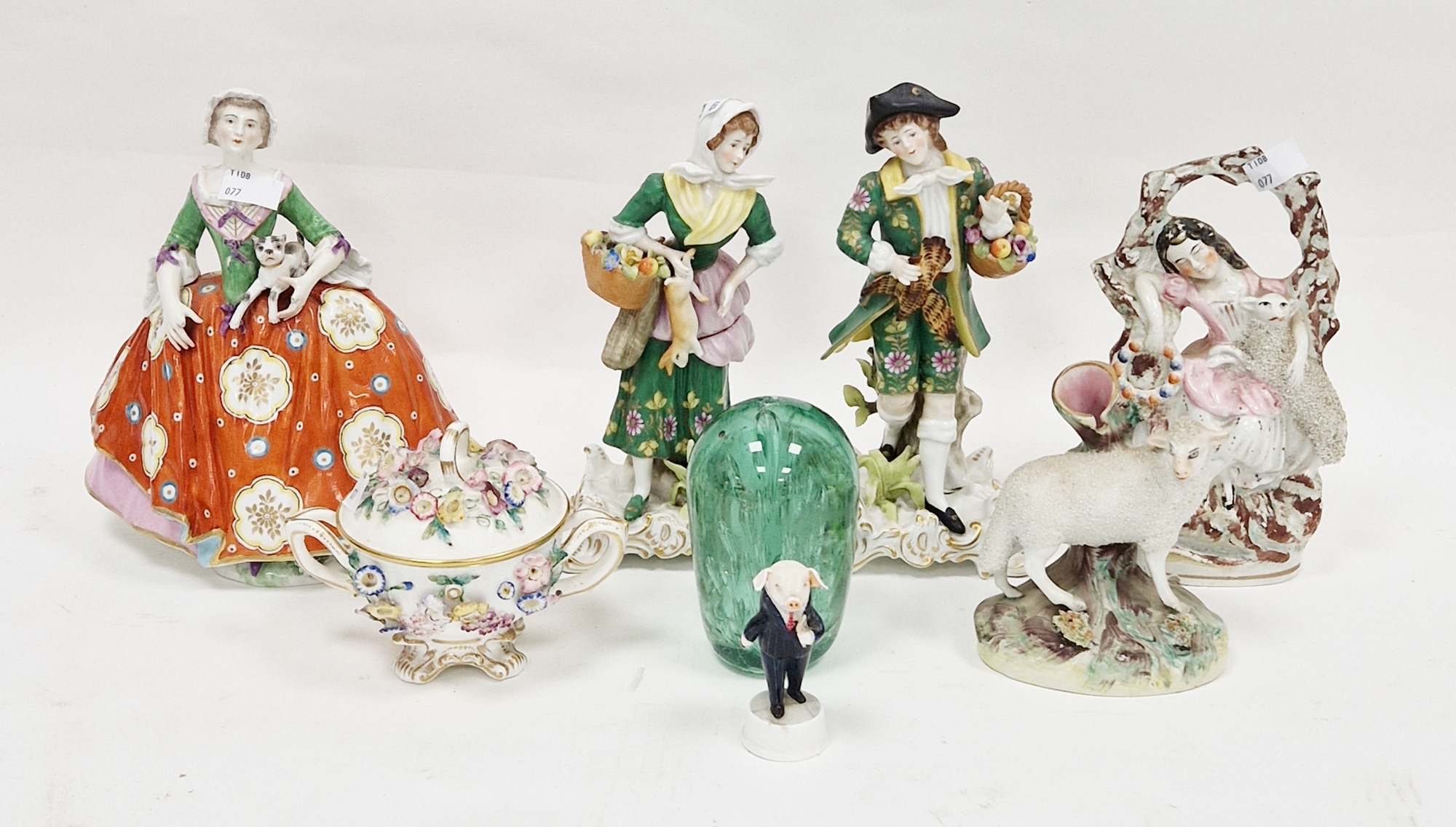 Continental porcelain figure of lady in crinoline dress holding dog, gold anchor mark, pair