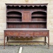 Large 18th/19th century oak and walnut inlaid dresser, the upper section with moulded pediment