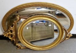 Three gilt framed mirrors including a 19th century oval mirror with moulded frame and the plate with