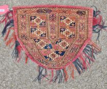 Turkman saddle cover, cognac with centre panel in blues, brown, cream, seven geometric designs in