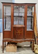 Edwardian mahogany inlaid bowfronted display cabinet with two glazed doors and central inverted