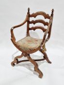 Victorian walnut Gothic Revival open armchair in the manner of Gillows, with shaped ladderback,