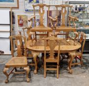 Early 20th century Chippendale Revival pine dining room suite comprising an oval dining table with