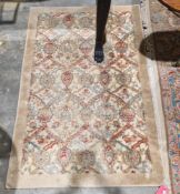 Cream ground floral pattern rug in green, red and blue, 107cm x 168cm  Property of Dunkirk Manor,