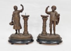 Pair of 19th century spelter figures of a fishmonger and his wife, both with baskets of fish held on