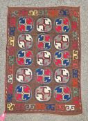 Uzbek embroidered kilim with brown backgrounds, 15 circle designs in red, yellow, green and blue,