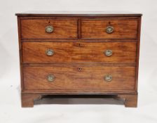 George III mahogany chest of two short and two long graduating cockbeaded drawers, the top with
