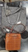 A brown plaited leather Russell and Bromley bucket bag , zip fastening, gilt hardware with tassel