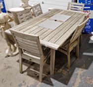 Large teak Gloster garden table with two perforated metal panels to the centre and six chairs (7)