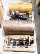 Four various late 19th/early 20th century cased sewing machines, to include Superba and three Singer