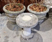 Pair of large composite stone jardinieres with banded and bow and ribbon decoration and a two-part
