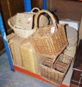 A quantity of woven baskets and hampers in various sizes and designs