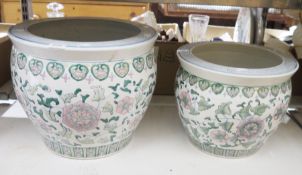 A large Chinese ceramic jardiniere/planter decorated with floral pattern and another smaller example