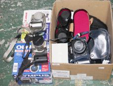 Assorted cameras and camera accessories, including: a boxed Olympus C-2100 ultra zoom digial camera,