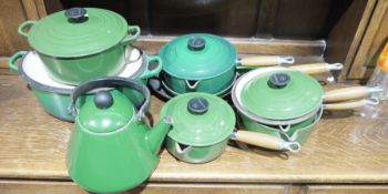A collection of Le Creuset kitchenware to include cast iron casserole dishes, cast iron lidded