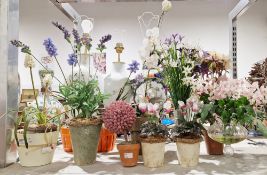 A quantity of faux floral arrangements the majority contained within ceramic or glass planters to