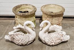 Pair of composite stone large jardinieres of circular form with cherub and swag decoration and two