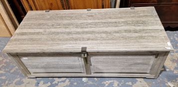 A weathered panelled teak garden chest, with swing metal handles, with airholes, 45.5cm x 131xm wide
