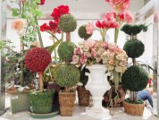 A quantity of faux plant arrangements the majority contained within ceramic planters, to include
