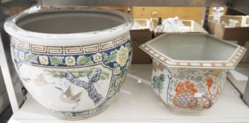 A large Chinese style Jardiniere decorated with floral patterns, the central panel of two herons