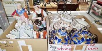 Pair of continental ceramic figures depicting a woman with a jug and cup and a male fixing a shoe,