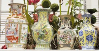 Four ceramic vases to include a s Satsuma style vase decorated with floral panels and panels of