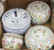 A pair of Chinese lidded jars decorated with branches bearing peaches, a pair of stoneware orchard
