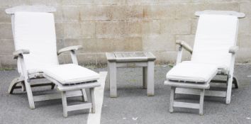 Pair of teak steamer chairs with cream cushions and a teak small garden table (3)  Condition