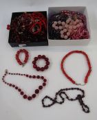 A quantity of pink and purple bead necklaces, a quantity of red bead necklaces to include garnet (