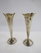 Pair of silver vases, Birmingham 1981, maker's mark rubbed, of fluted trumpet form, weighted, 17.5cm