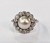 Platinum, pearl and diamond ring, the central pearl surrounded by diamonds, finger size M1/2
