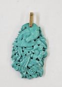 Carved turquoise-coloured stone pendant, bird and floral decorated, 6.5cm long, 18gms approx.