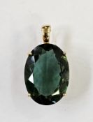 Gold-coloured metal and green stone pendant, the oval stone in claw setting