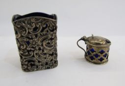 Edwardian silver bottle stand, rectangular, scroll pierced and repousse with blue glass liner, 7cm