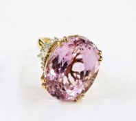 18k gold, kunzite and diamond dress ring, the large oval kunzite raised with diamonds to the